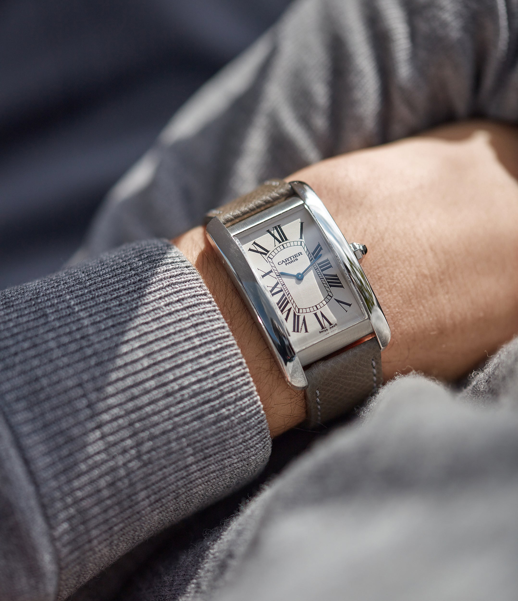 Cartier tank americaine on store wrist