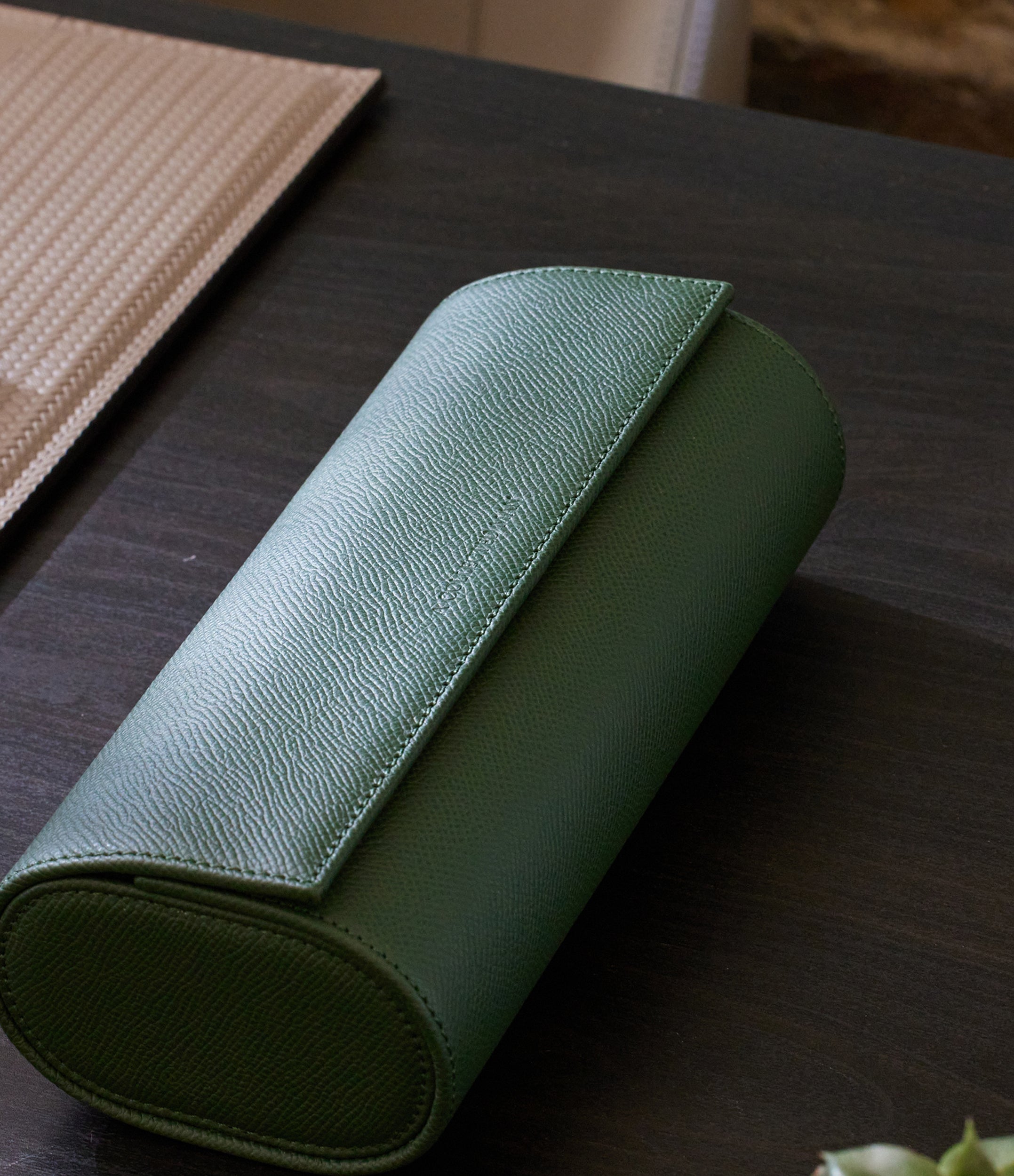 Three-watch roll, emerald, grained leather Buy at ACM London – A