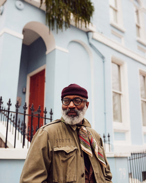 Jason Jules in Notting Hill, looking away from the camera and speaking about his fascination with the Ivy League style, interview with A Collected Man London