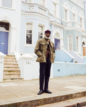 Jason Jules in Notting Hill, looking away from the camera and speaking about his fascination with the Ivy League style, interview with A Collected Man London