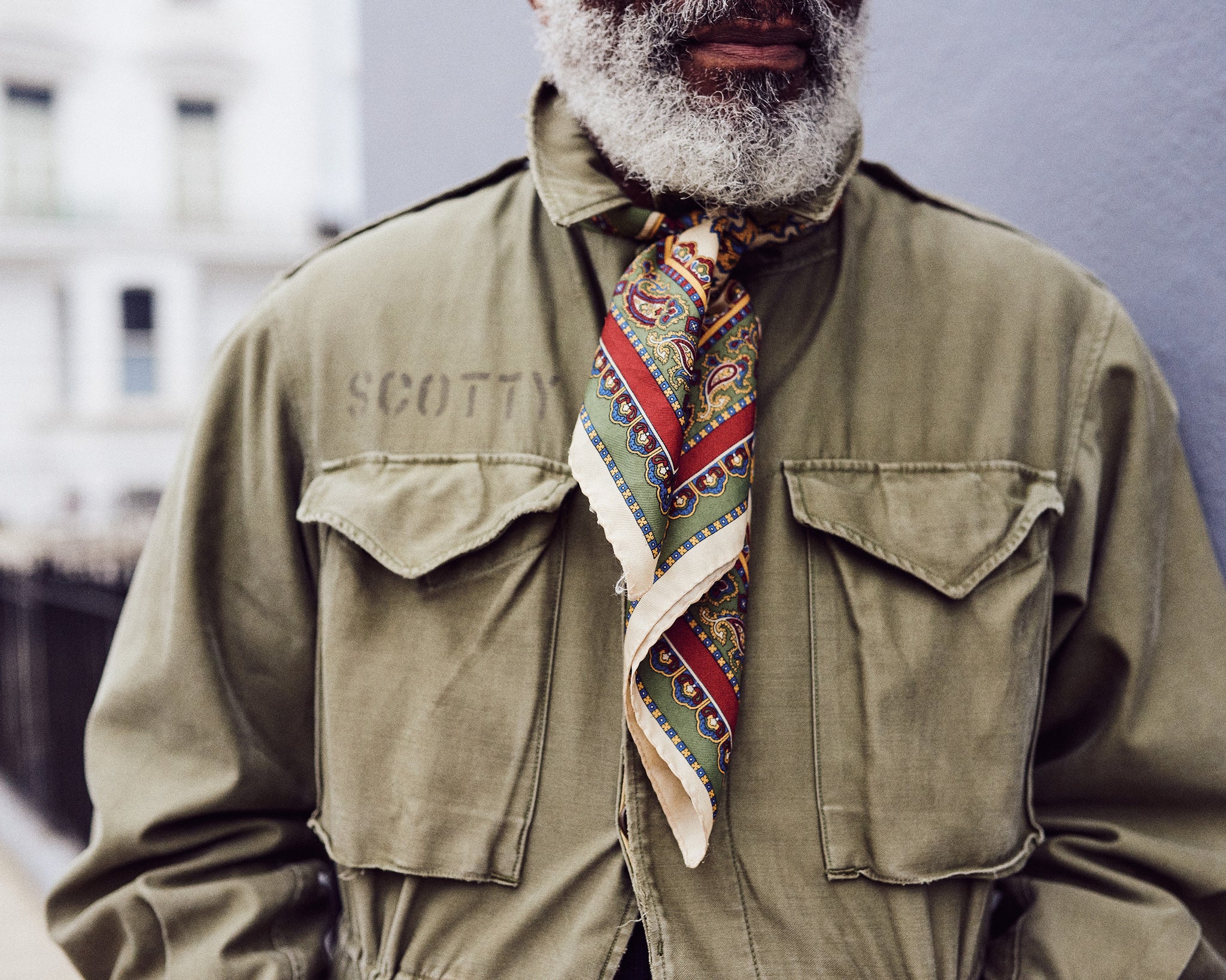 Jason Jules against a dark background, discussing Ivy Style and his interest in African American fashion. Read the interview at A Collected Man London.