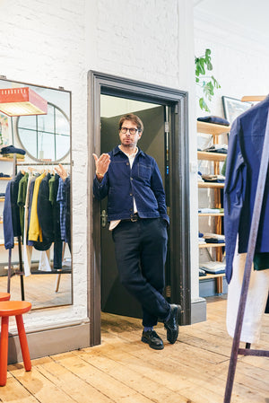 Oliver Spencer standing in the doorway of his retail shop interviewed by A Collected Man London