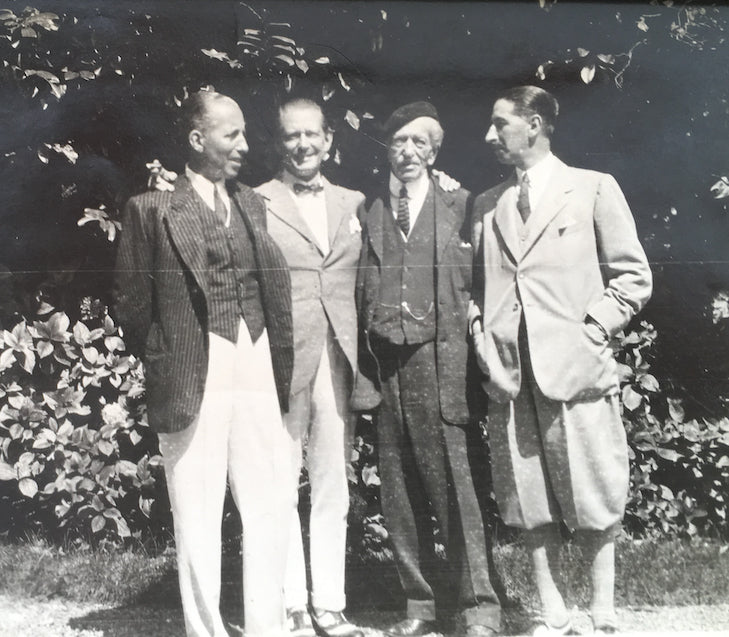 Three Cartier brothers and their father
