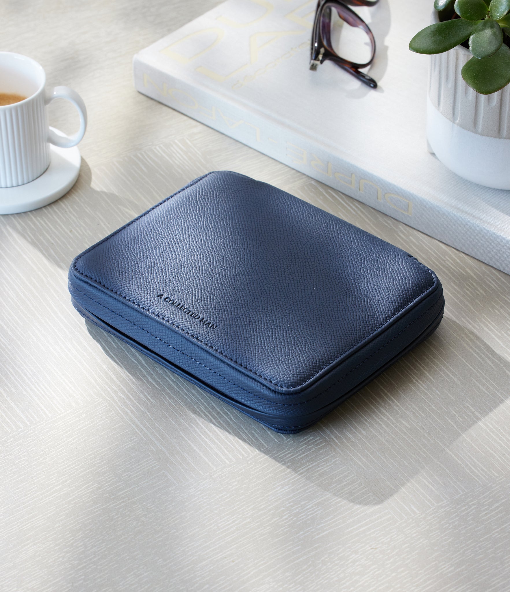 Four-watch slim folio in midnight blue grained leather, Handmade in France by skilled craftsmen from classic, midnight blue grained leather, it’s a slim case with a tactile, natural feel | A Collected Man
