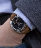 on the wrist buy AkriviA Tourbillon Regulateur steel watch black dial by independent manufacture at A Collected Man