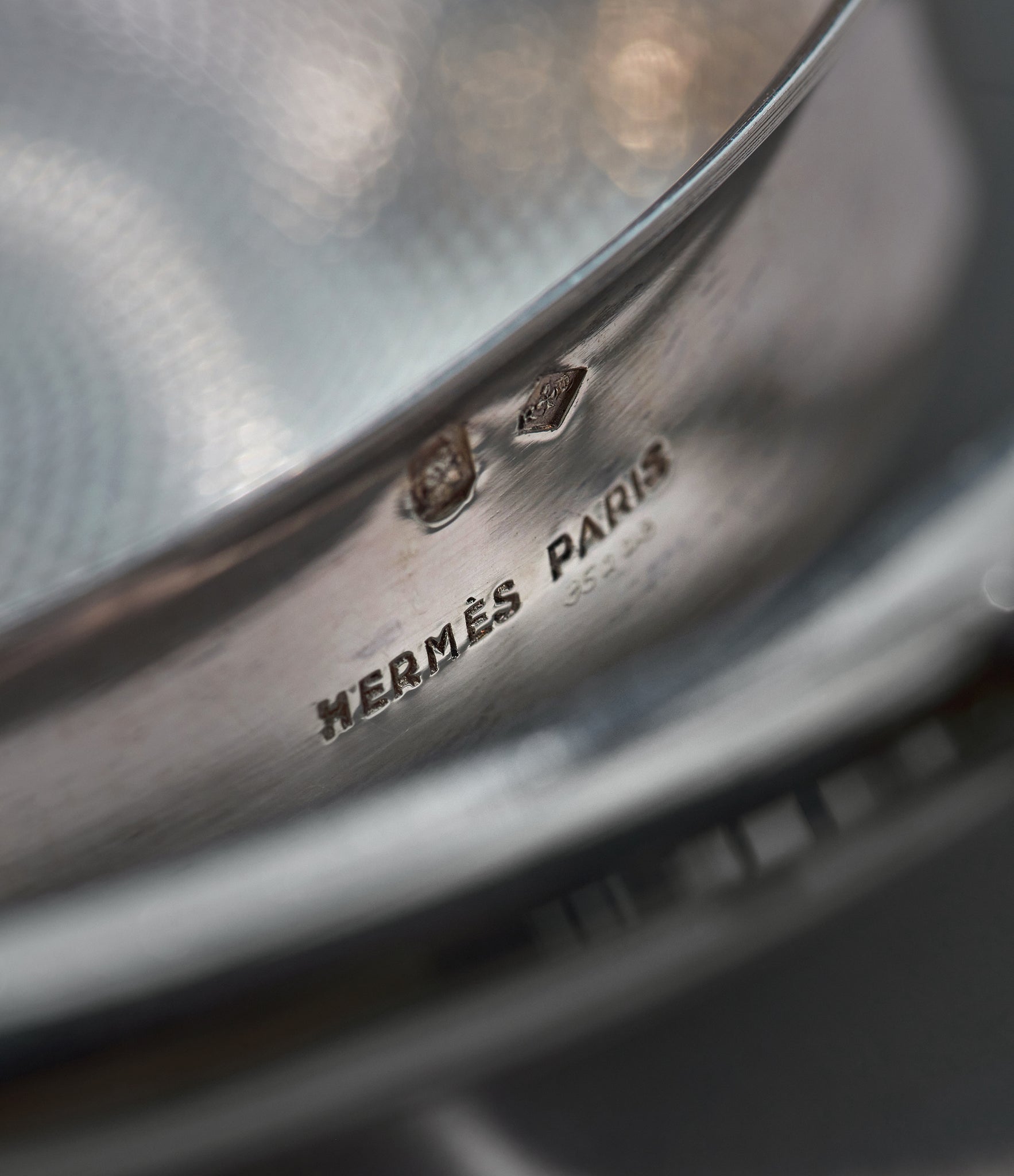 silver engine-turned Hermès Paris argent tastevin-style cigar holder ashtray A Collected Man