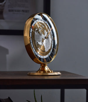 Side shot on desk of rare vintage IMHOF World Time Clock with heure universelle complication for sale at A Collected Man London