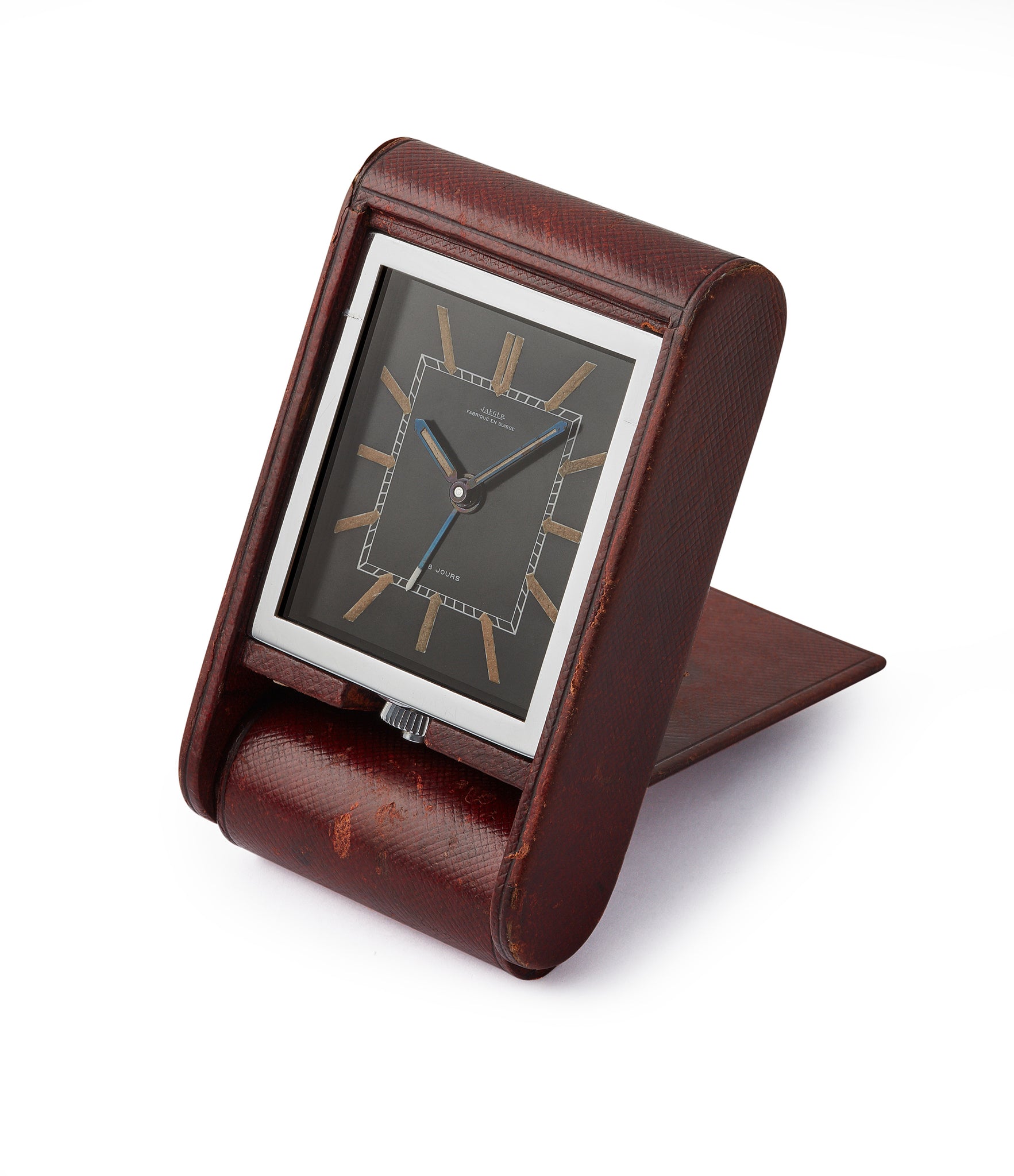 side-shot vintage Jaeger-LeCoultre travel alarm clock with black dial and brown case at A Collected Man London