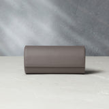 Watch Case | Three-watch oval-shaped roll in stone grey grained leather | A Collected Man | Available Worldwide