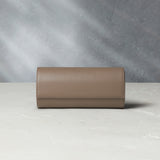 Watch Case | Three-watch oval-shaped roll in desert taupe Saffiano leather | A Collected Man | Available World Wide