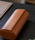 Watch Case Three-watch oval-shaped roll in whisky-tan Saffiano leather | A Collected Man | Available World Wide