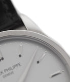 Patek Philippe Calatrava 5196G-001 18-carat white gold manual-winding pre-owned watch with silver dial and black strap