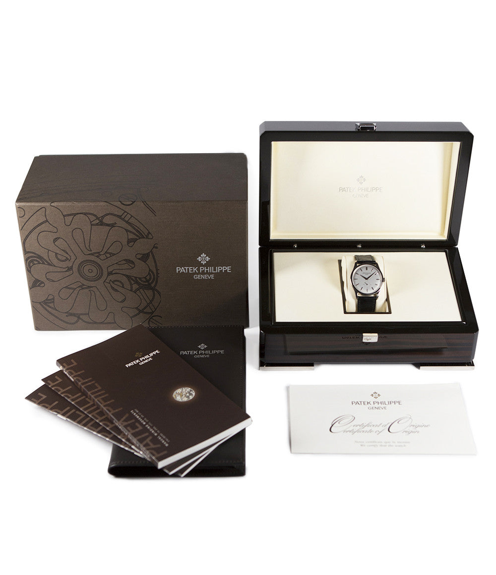 Patek Philippe Calatrava 5196G-001 18-carat white gold manual-winding pre-owned watch with silver dial and black strap