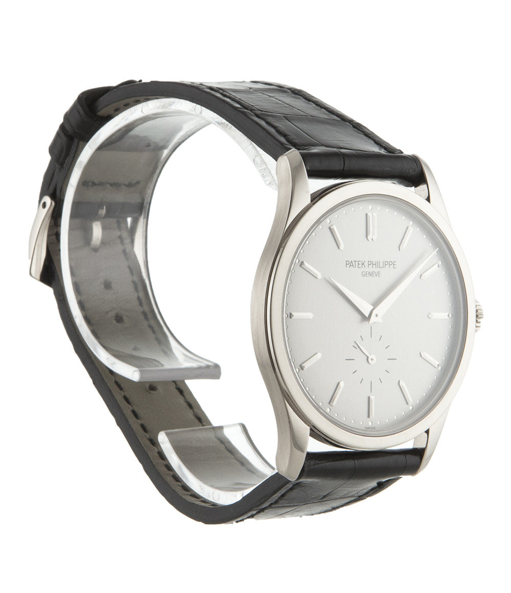 Patek Philippe Calatrava 5196G-001 18-carat white gold manual-winding pre-owned watch with silver dial and black strap