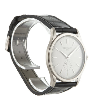 Patek Philippe Calatrava 5196G-001 18-carat white gold manual-winding pre-owned watch with silver dial and black strap