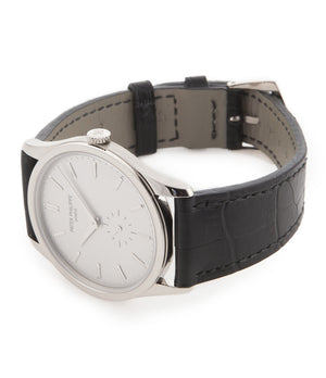 Patek Philippe Calatrava 5196G-001 18-carat white gold manual-winding pre-owned watch with silver dial and black strap