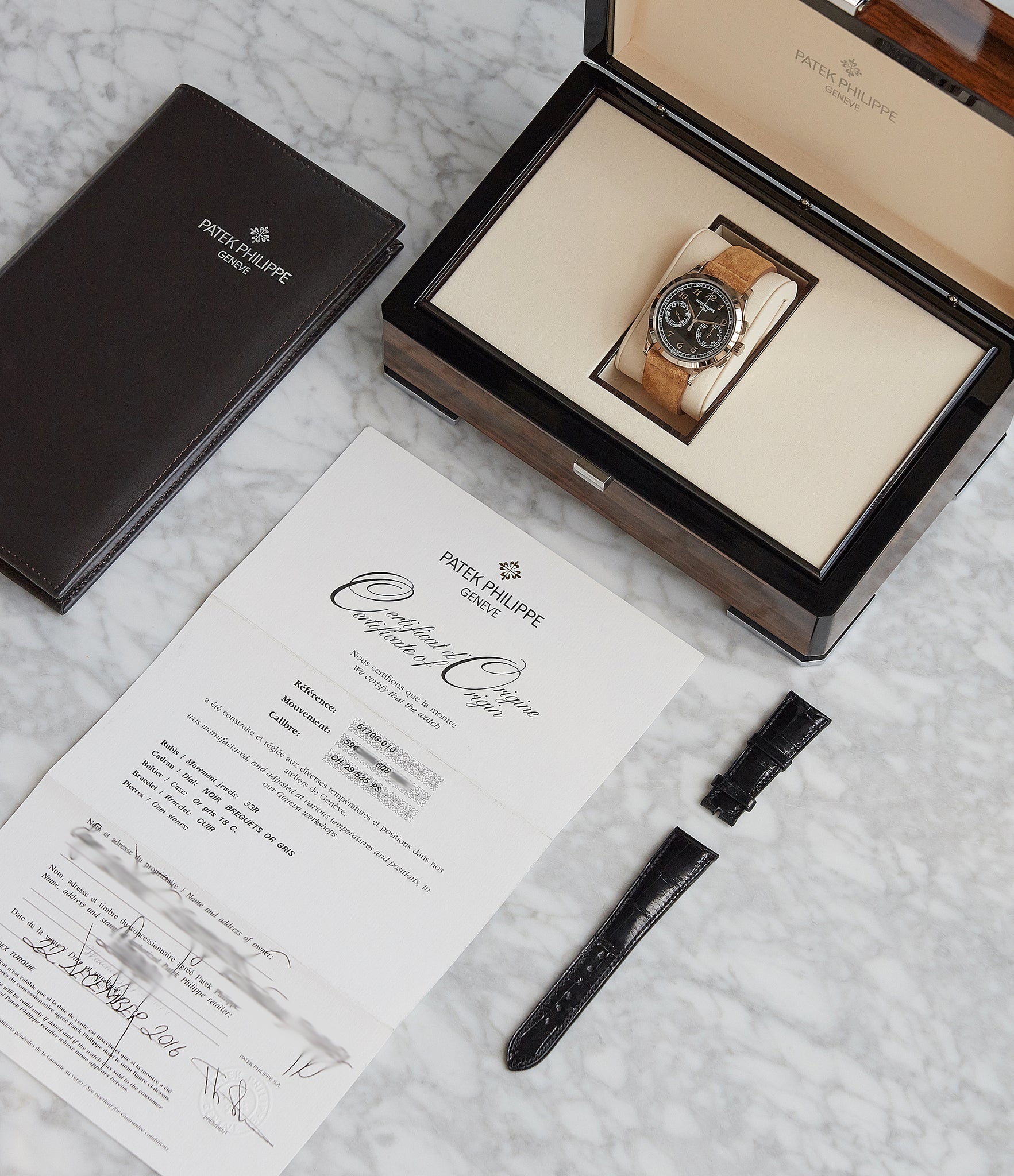 full set pre-owned Patek Philippe 5170G-010 Chronograph black dial manual-winding watch for sale online at A Collected Man London UK specialist of rare watches