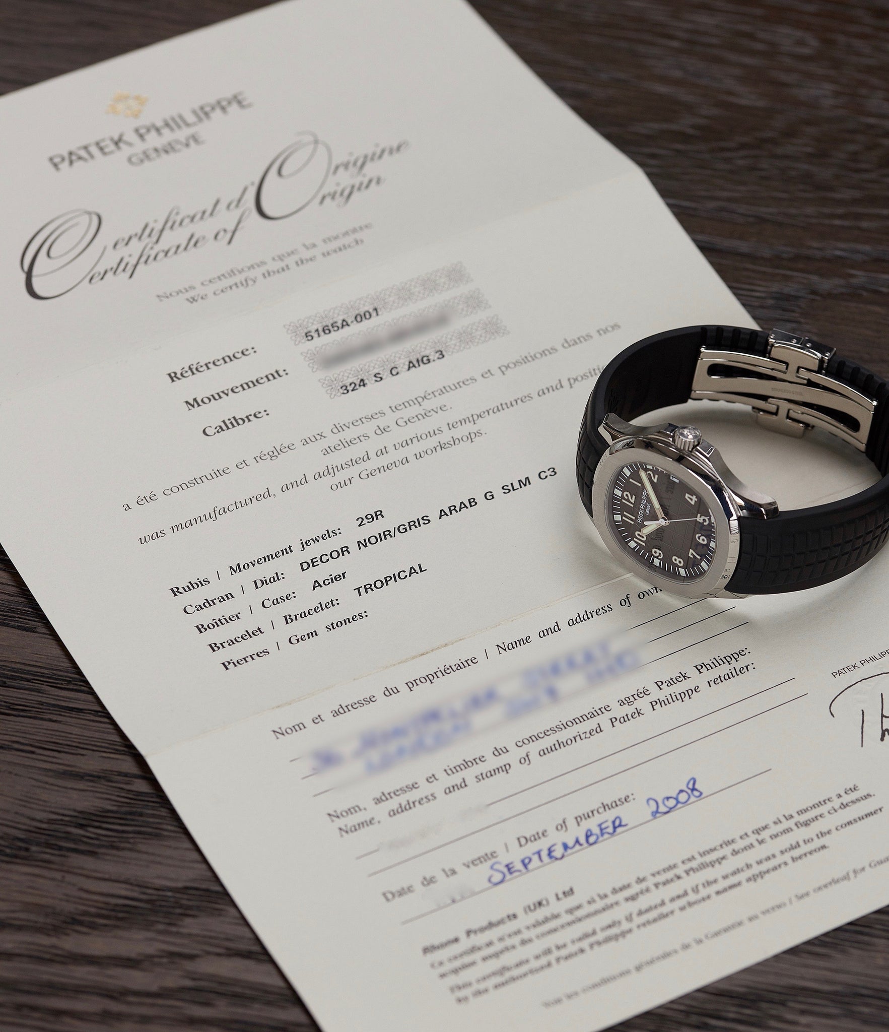 Patek Philippe Aquanaut 5165A-001 with papers pre-owned steel 38mm sports dress watch for sale online A Collected Man London UK specialist of rare watches