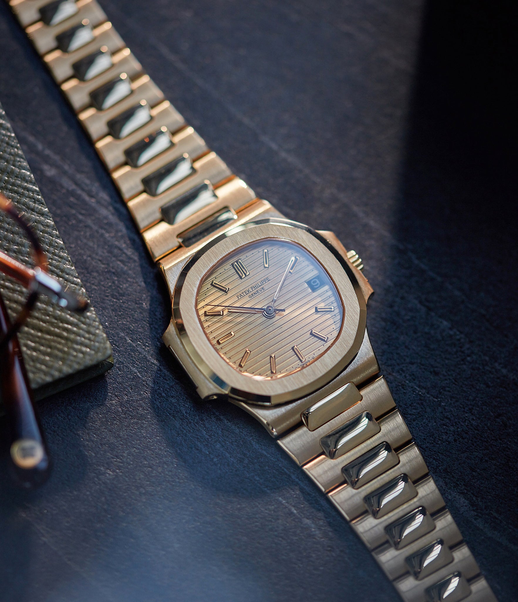selling Patek Philippe Nautilus Ref. 3800-001J yellow gold dark date disc luxury sports watch for sale online A Collected Man London UK specialist rare watches