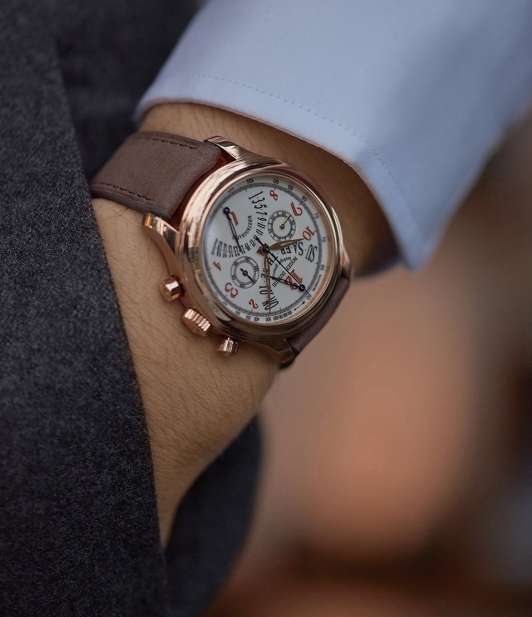 on the wrist Roger Dubuis Hommage bi-retrograde Chronograph H40 560 limited edition rare rose gold lacquer dial watch for sale online at A Collected Man London UK specialist of rare watches