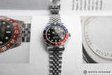 buy Rolex GMT Master with Tiffany dial 16750 stainless steel automatic Cal. 3075 vintage authentic pre-owned dress, sport luxury watch from 1984 with black dial and stainless steel Rolex bracelet with date, chronometer, gmt, hours, minutes, center seconds