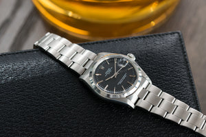 Rolex 1500 steel black sigma dial date sports vintage watch for sale online at A Collected Man vintage watch specialist
