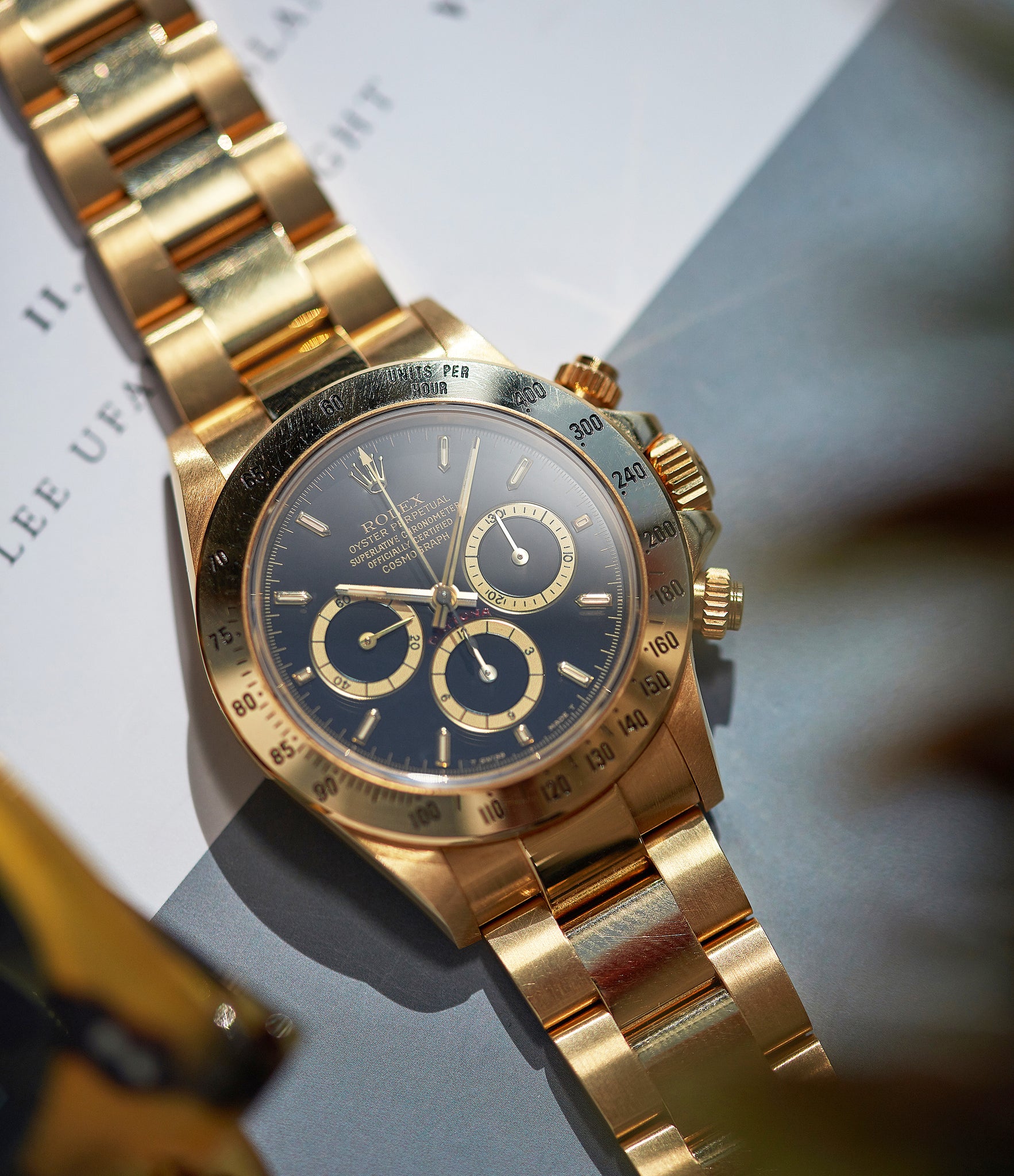 shop vintage Rolex Daytona Zenith 16528 yellow gold black dial full set watch for sale online at A Collected Man London UK specialist of rare watches