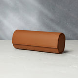 Rome, four-watch roll Four-watch oval-shaped roll in whisky-tan grained leather | Available Worldwide | A Collected Man