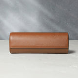 Rome, four-watch roll Four-watch oval-shaped roll in whisky-tan Saffiano leather | A Collected Man | Available Worldwide