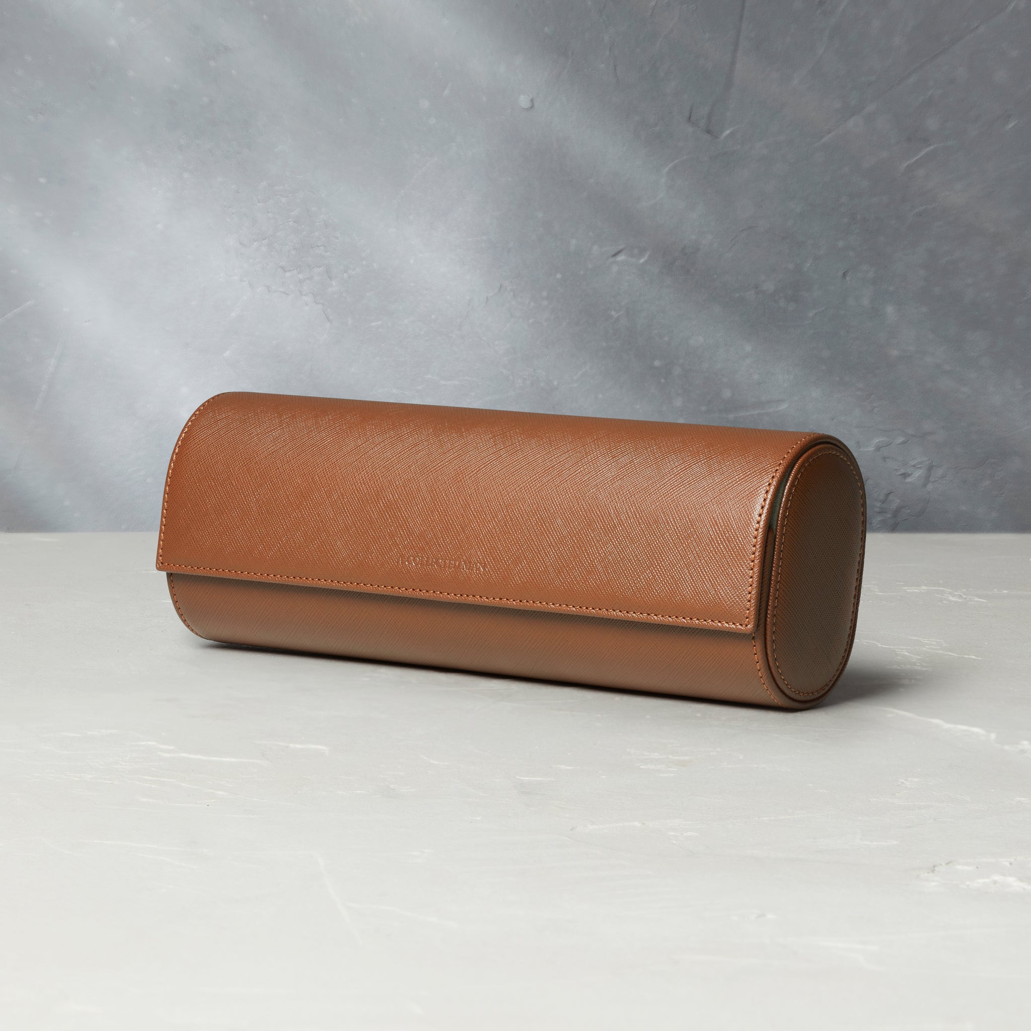 Rome, four-watch roll Four-watch oval-shaped roll in whisky-tan Saffiano leather | A Collected Man | Available Worldwide
