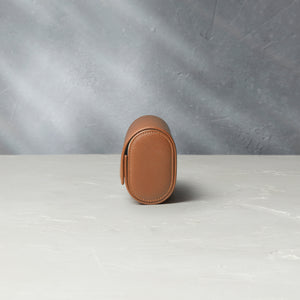 Rome, four-watch roll Four-watch oval-shaped roll in whisky-tan Saffiano leather | A Collected Man | Available Worldwide