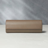 Rome, four-watch roll Four-watch oval-shaped roll in desert taupe Saffiano leather | A Collected Man | Available Worldwide