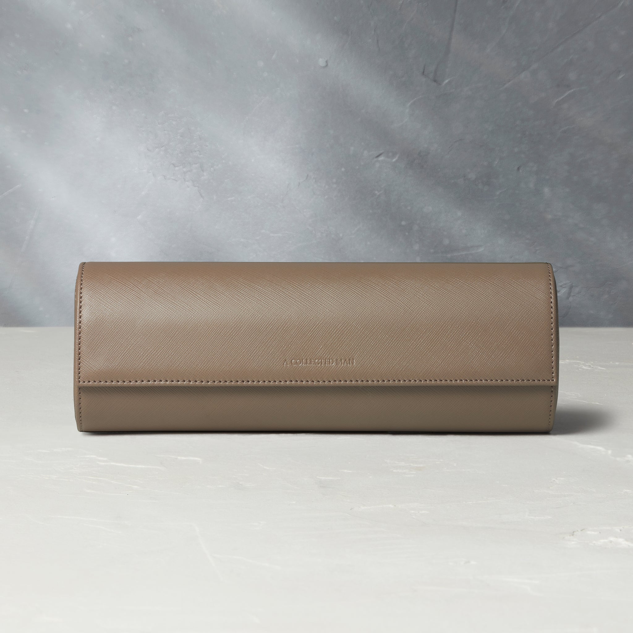Rome, four-watch roll Four-watch oval-shaped roll in desert taupe Saffiano leather | A Collected Man | Available Worldwide
