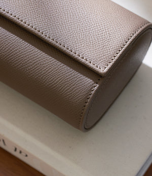 Rome, four-watch roll Four-watch oval-shaped roll in truffle grained leather | Available World Wide | A Collected Man