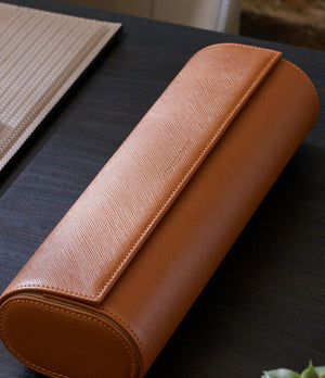Rome, four-watch roll Four-watch oval-shaped roll in whisky-tan Saffiano leather | A Collected Man | Available World Wide