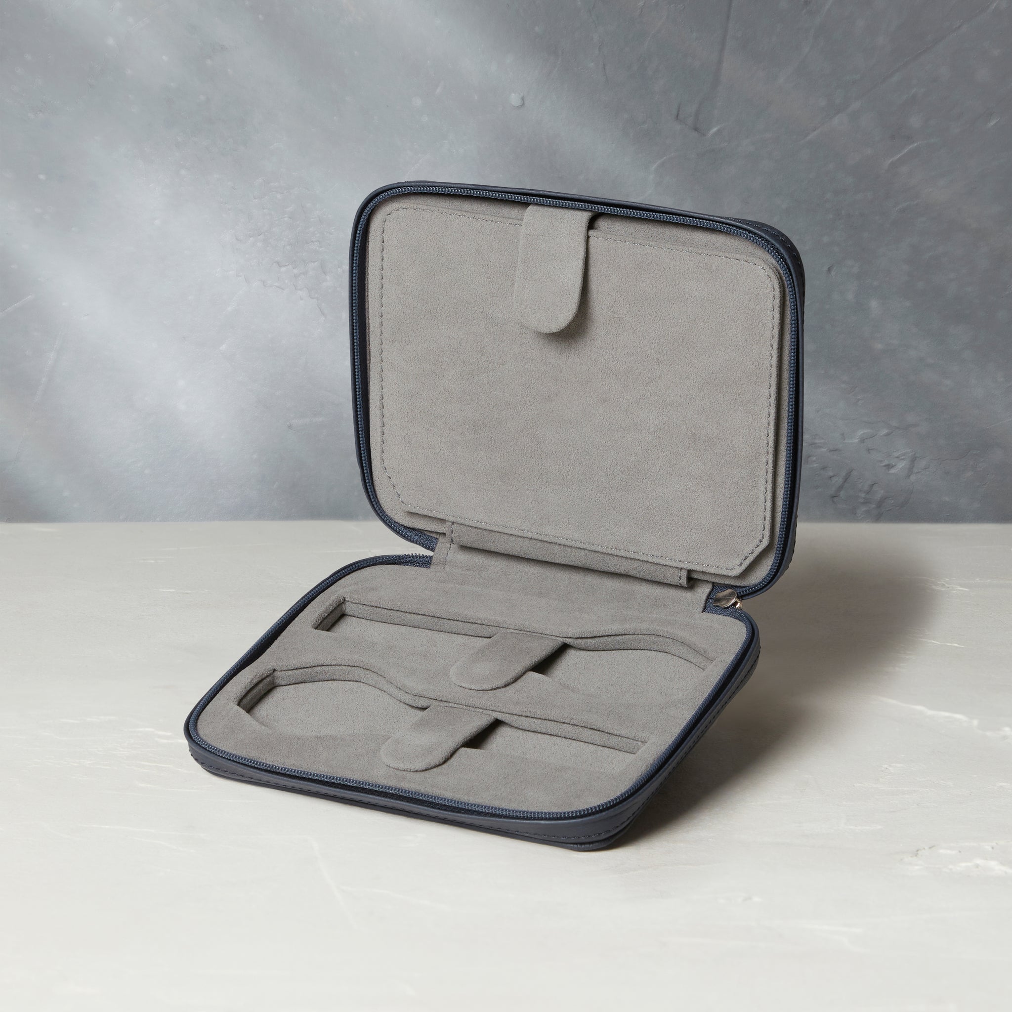 Four-watch slim folio in midnight blue grained leather, Handmade in France by skilled craftsmen from classic, midnight blue grained leather, it’s a slim case with a tactile, natural feel | A Collected Man