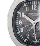 buy Patek Philippe Aquanaut Travel-time 5164A-001 steel pre-owned traveller automatic watch black dial dual time zone with box and papers for sale at WATCH XCHANGE London authenticity guaranteed
