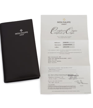buy Patek Philippe Aquanaut Travel-time 5164A-001 steel pre-owned traveller automatic watch black dial dual time zone with box and papers for sale at WATCH XCHANGE London authenticity guaranteed