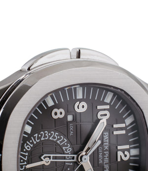 buy Patek Philippe Aquanaut Travel-time 5164A-001 steel pre-owned traveller automatic watch black dial dual time zone with box and papers for sale at WATCH XCHANGE London authenticity guaranteed