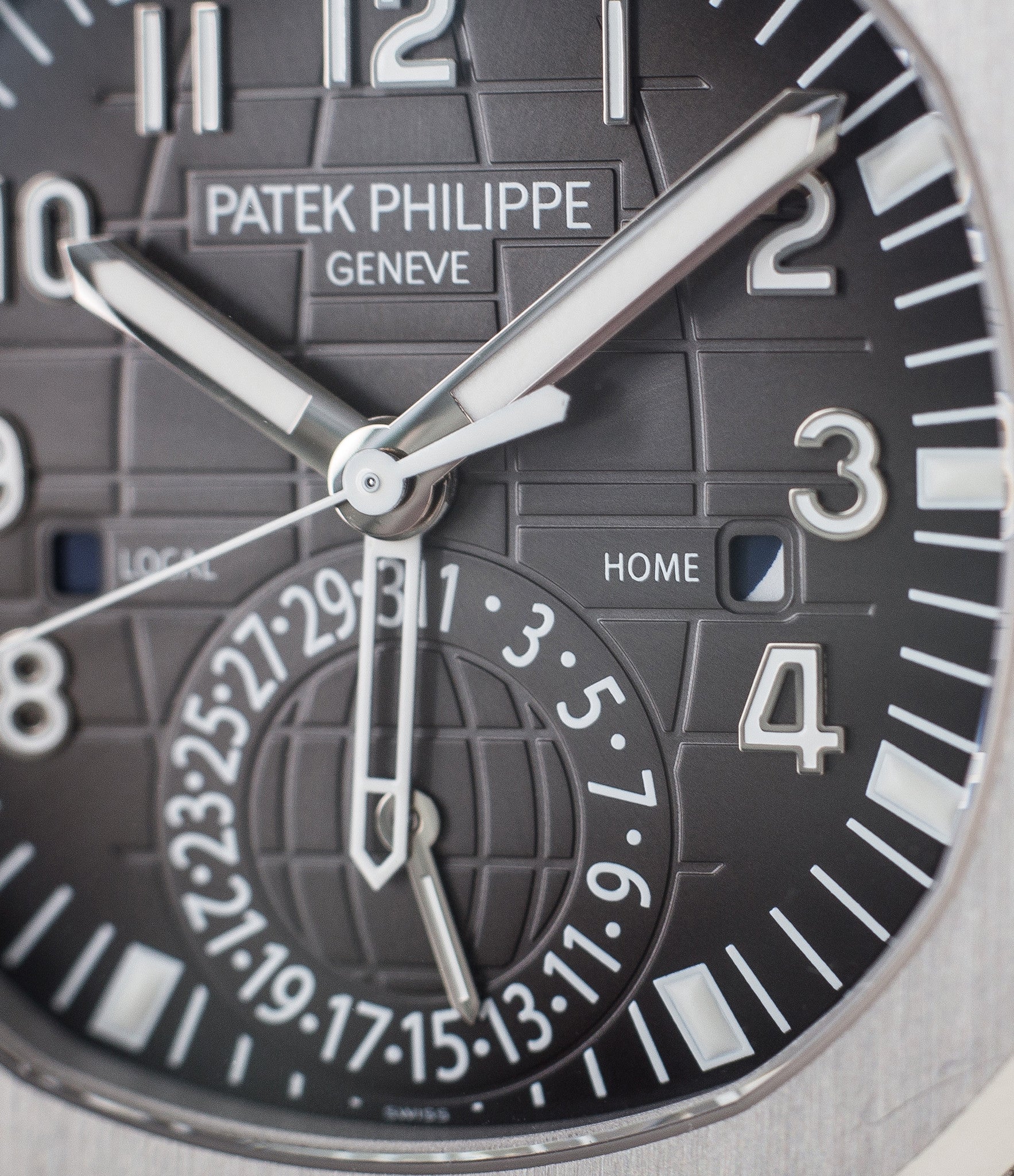 buy Patek Philippe Aquanaut Travel-time 5164A-001 steel pre-owned traveller automatic watch black dial dual time zone with box and papers for sale at WATCH XCHANGE London authenticity guaranteed