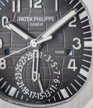 buy Patek Philippe Aquanaut Travel-time 5164A-001 steel pre-owned traveller automatic watch black dial dual time zone with box and papers for sale at WATCH XCHANGE London authenticity guaranteed